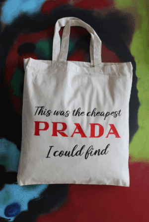 Tote bag large stof naturel met tekst: This was the cheapest PRADA ....